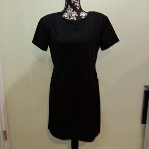 Olive and oak outfitters black pleated dress with shoulder pads size medium. Zoo